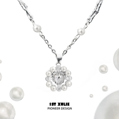 Elegant pearl statement necklace by 1ST XULIE featuring a unique design with various pearl sizes