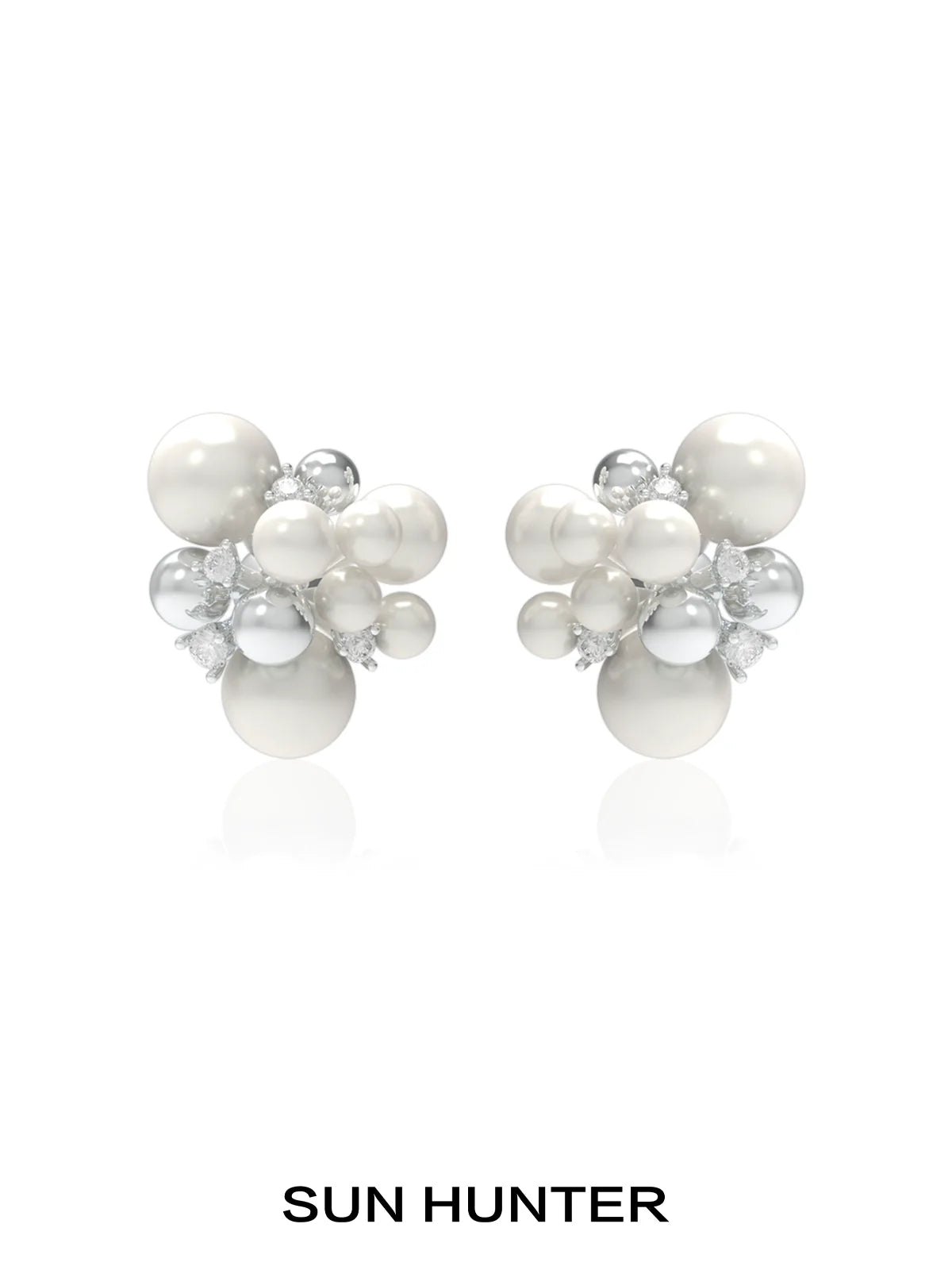 SUN HUNTER pearl zircon statement earrings featuring a cluster design with lustrous pearls and sparkling zircon.