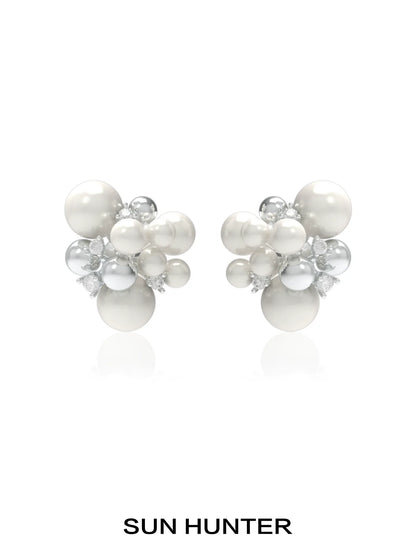SUN HUNTER pearl zircon statement earrings featuring a cluster design with lustrous pearls and sparkling zircon.