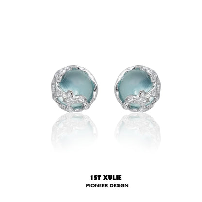 Stylish aqua gemstone stud earrings with a unique silver setting for elegant looks