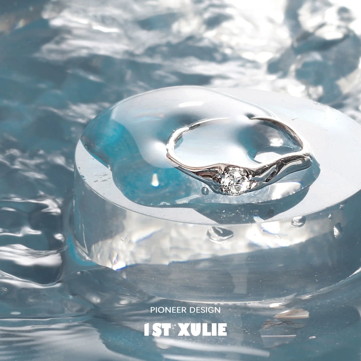 Elegant zircon silver ring displayed on a clear water surface highlighting its shine and design