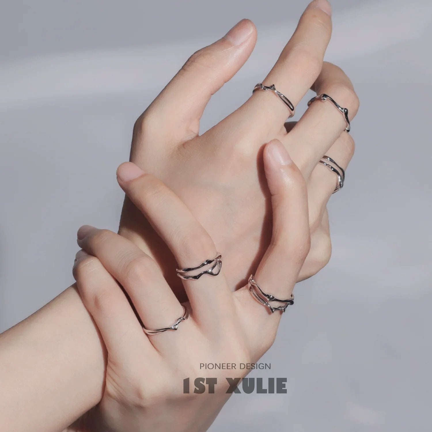 Minimalist silver line art ring showcased on multiple fingers for a stylish look