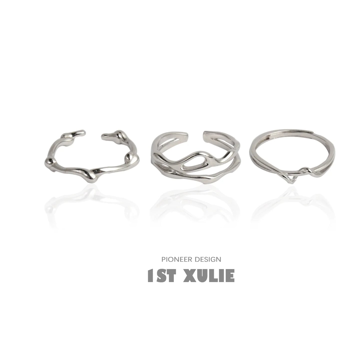 Set of three minimalist silver line art rings featuring unique organic shapes and designs