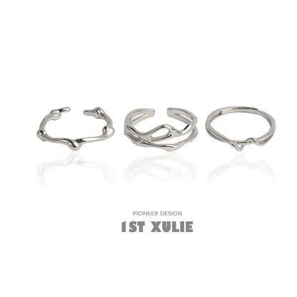 Set of three minimalist silver line art rings featuring unique organic shapes and designs