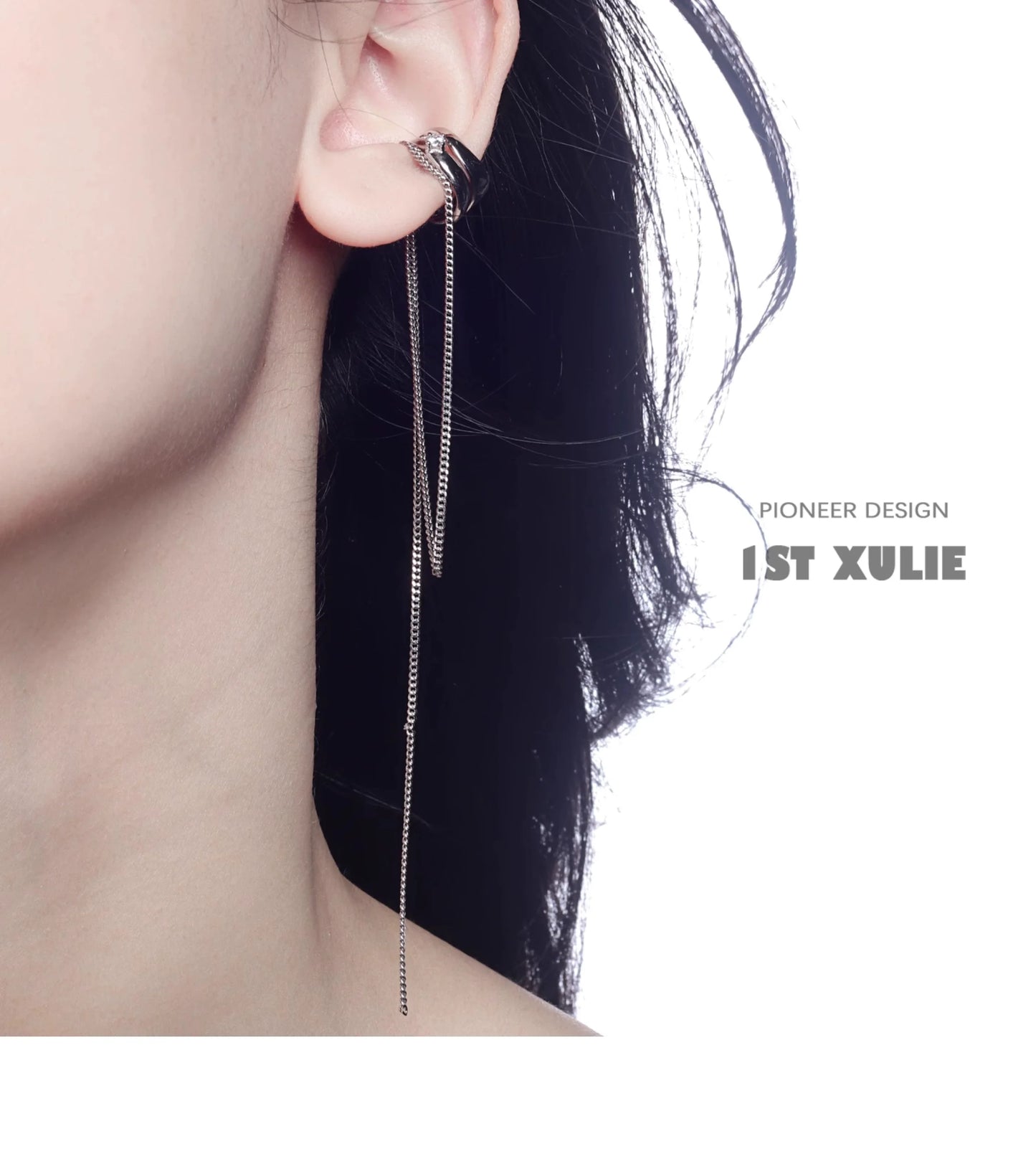 Punk tassel ear cuff by 1ST XULIE featuring a sleek design and dangling chain detail