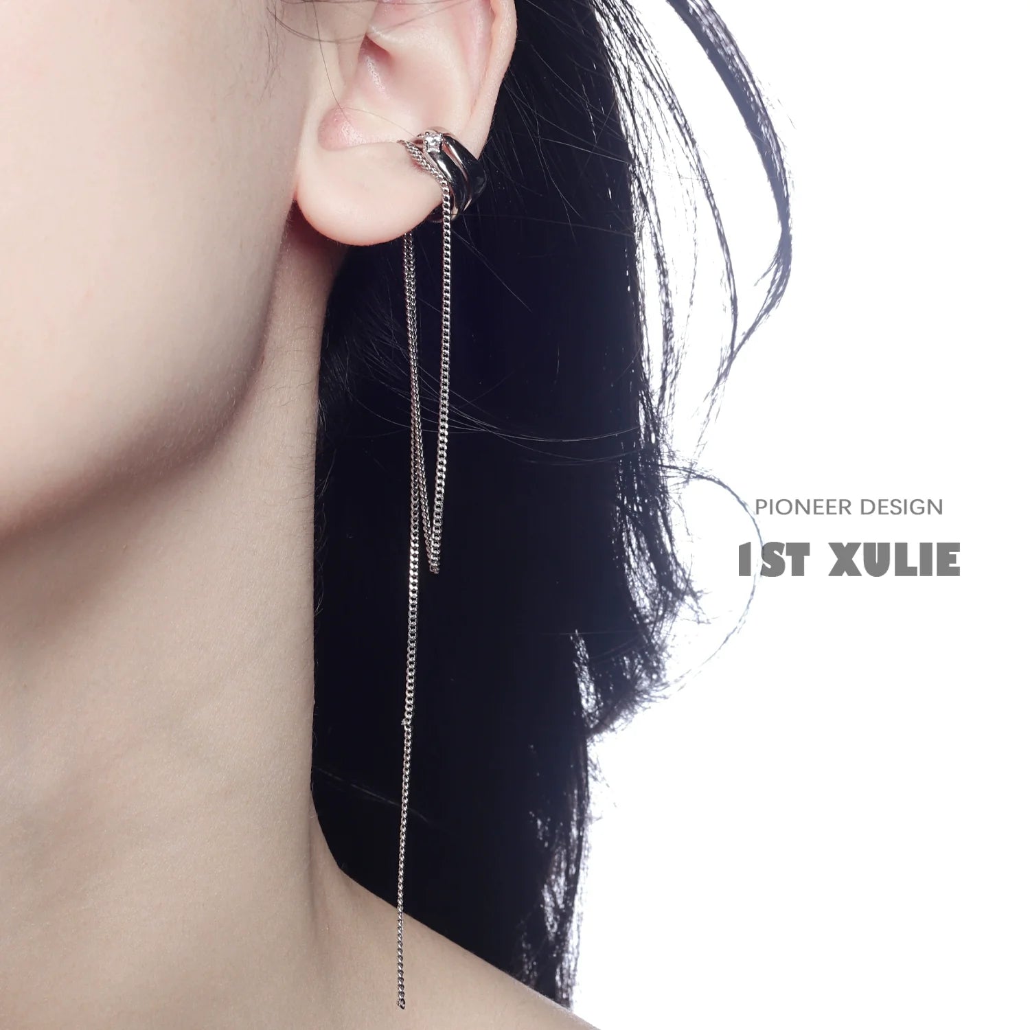 Stylish punk tassel ear cuff from 1STXULIE featuring a sleek design and chain detail