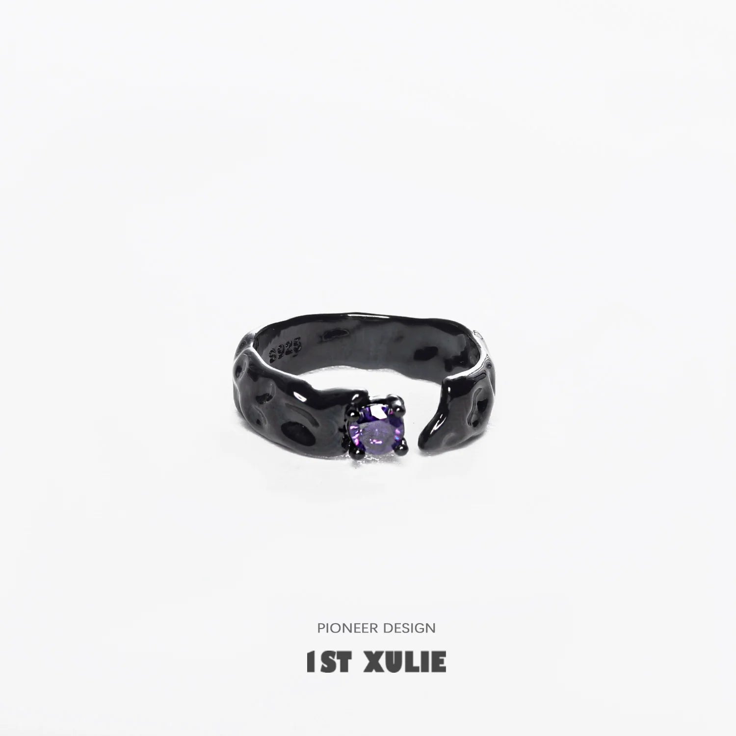 Y2K gothic couple rings featuring a unique textured design and violet gemstone centerpiece