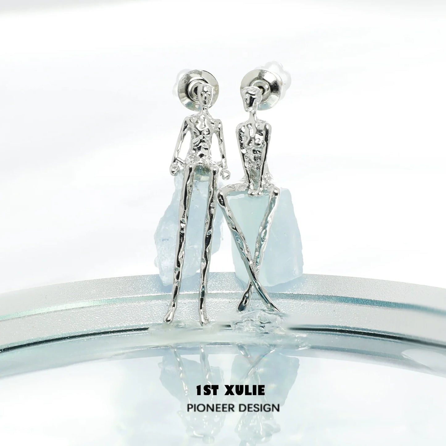 Y2K modern muse stud earrings in silver with unique human figure design for a trendy look