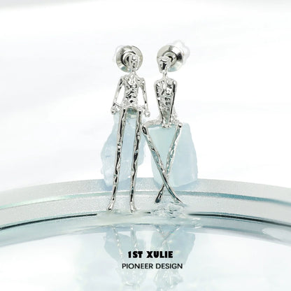 Y2K modern muse stud earrings in silver with unique human figure design for a trendy look