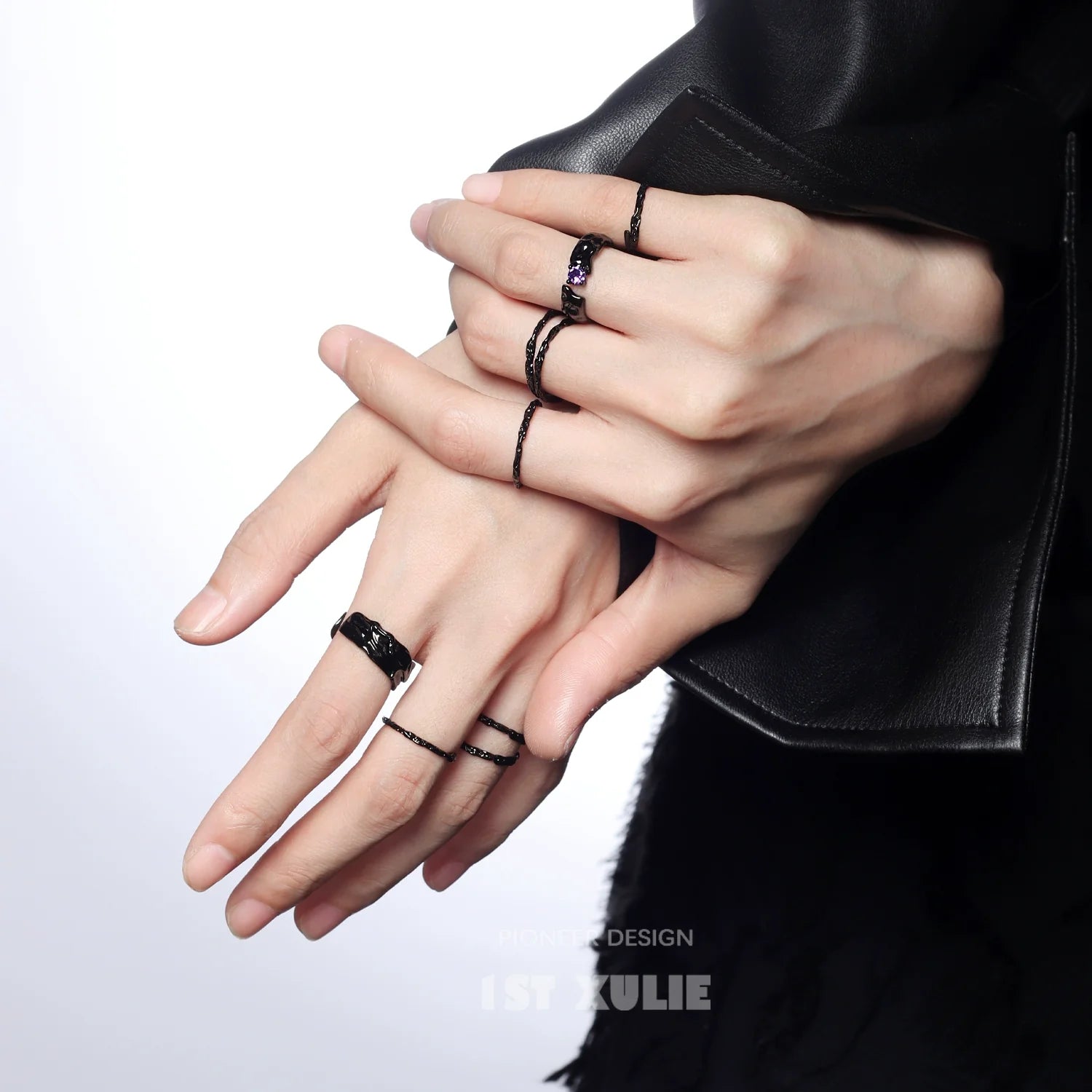 Y2K silver ring collection displayed on model's hands with stylish minimalist design