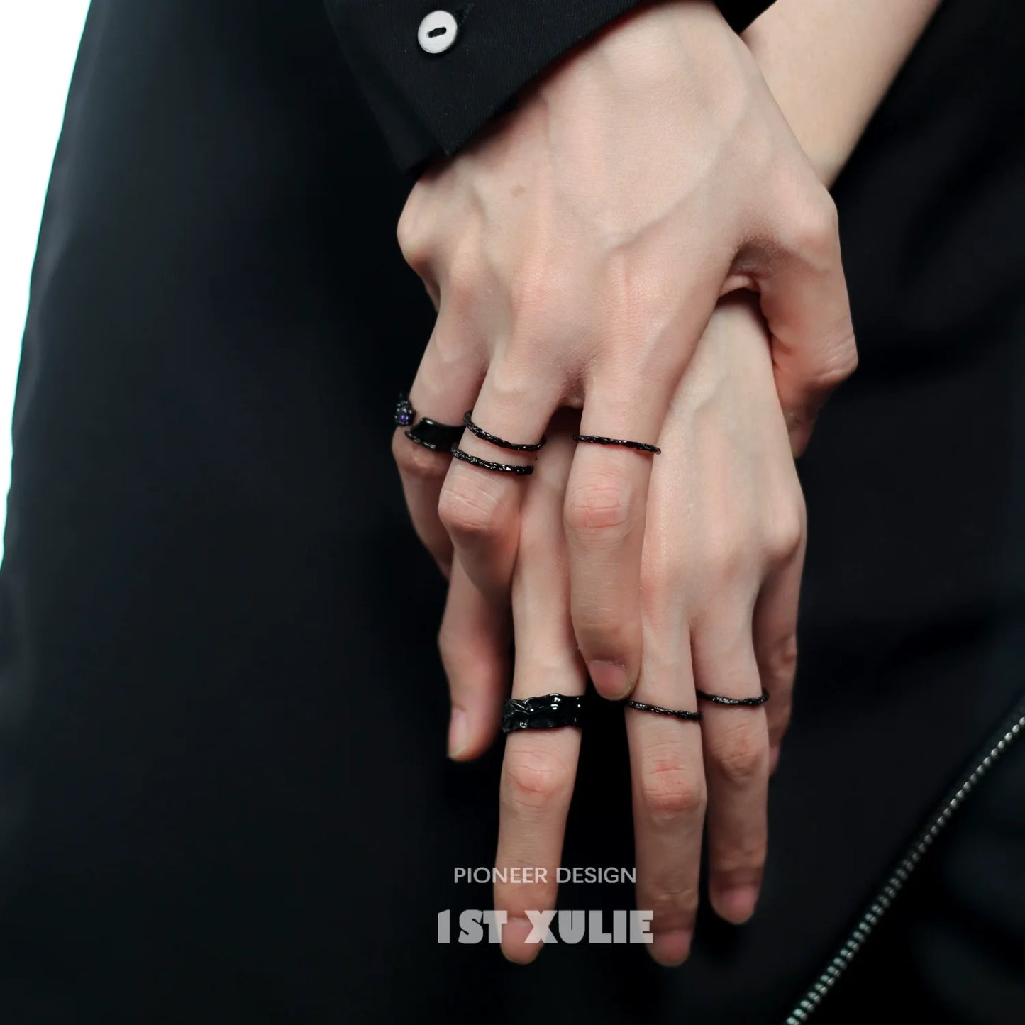Stylish Y2K silver ring collection showcased on hands with black and silver detailing