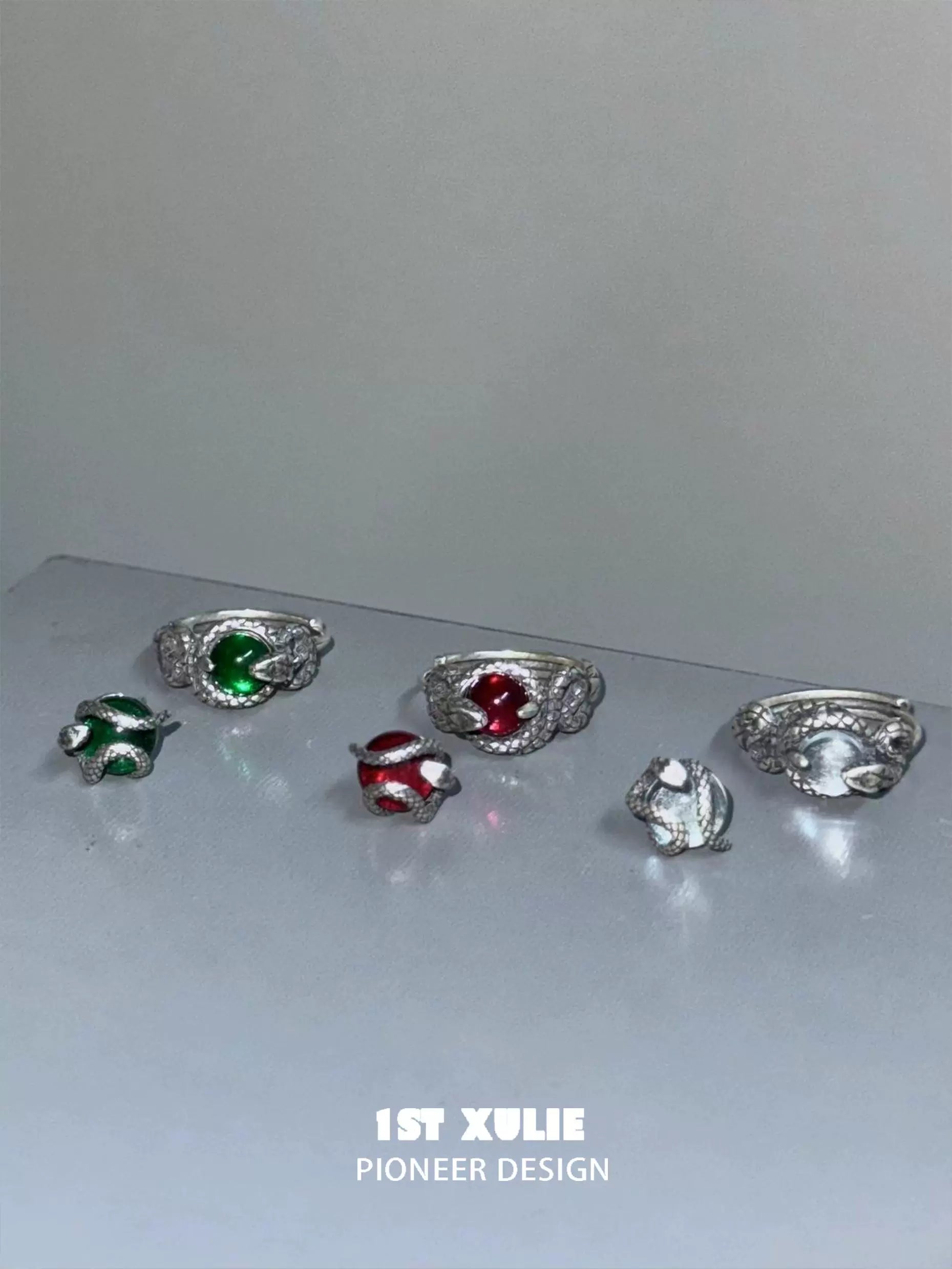 Y2K snake earrings with colorful stones in silver settings for a trendy accessory look