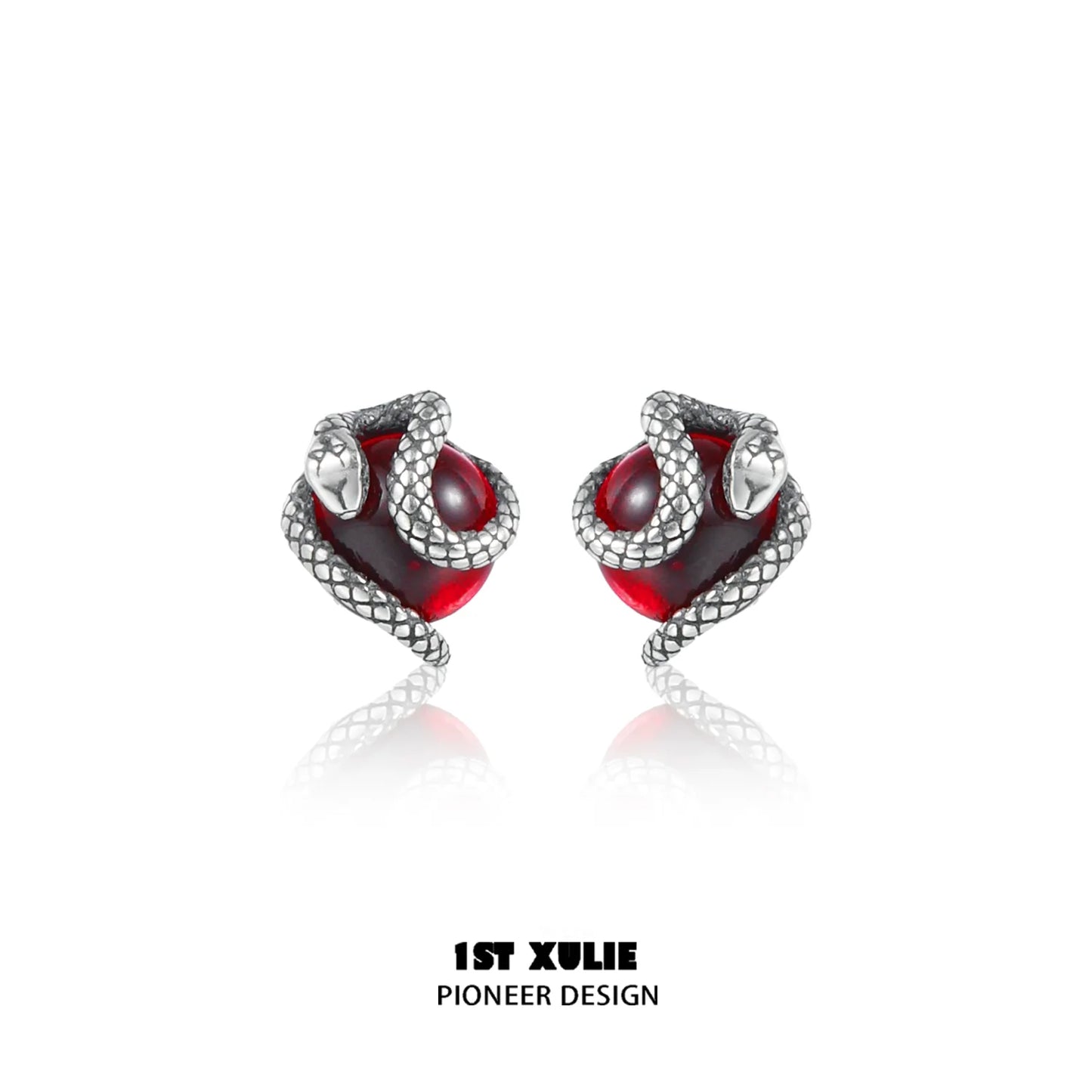 Y2K snake earrings with silver snake design wrapping around red gemstone for a stylish look