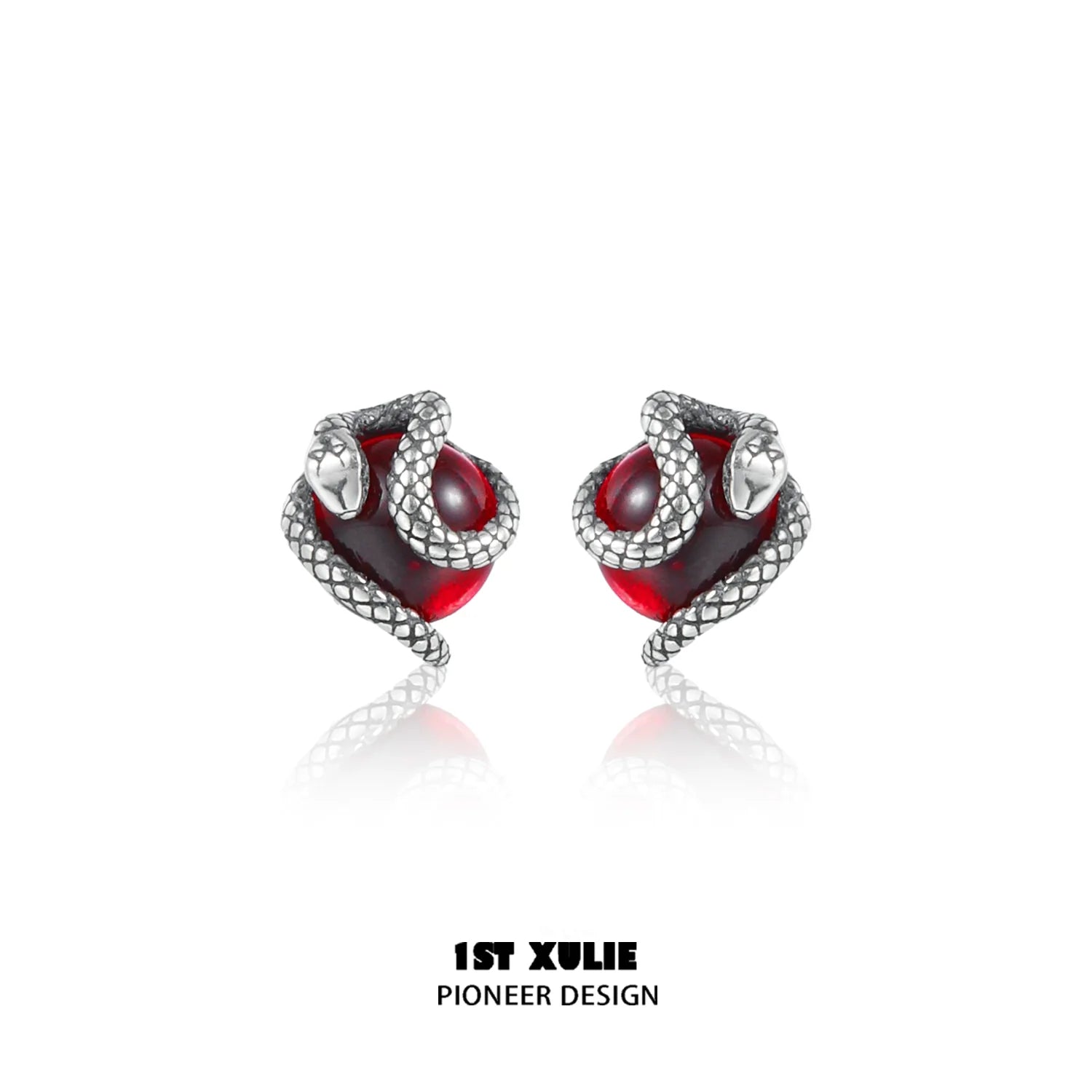 Y2K snake earrings with silver snake design wrapping around red gemstone for a stylish look