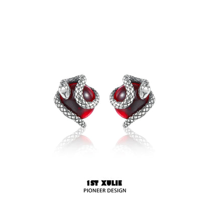 Y2K snake earrings with silver snake design wrapping around red gemstone for a stylish look