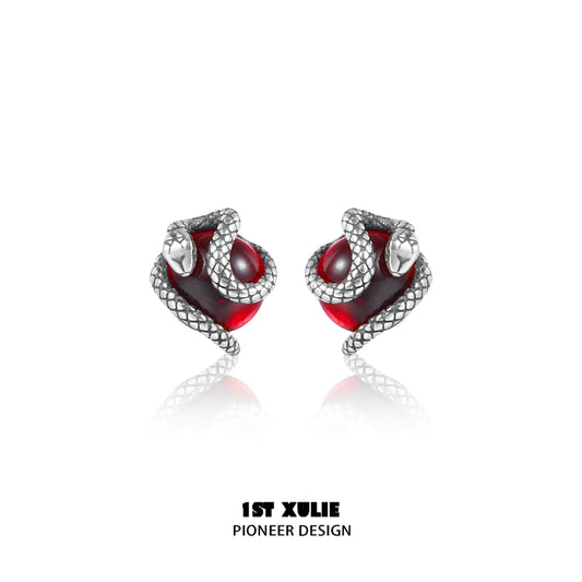 Y2K snake earrings with silver snake design wrapping around red gemstone for a stylish look