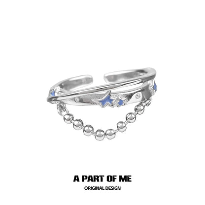 A PART OF ME planet chain ring featuring a sleek design with stars and shiny beads