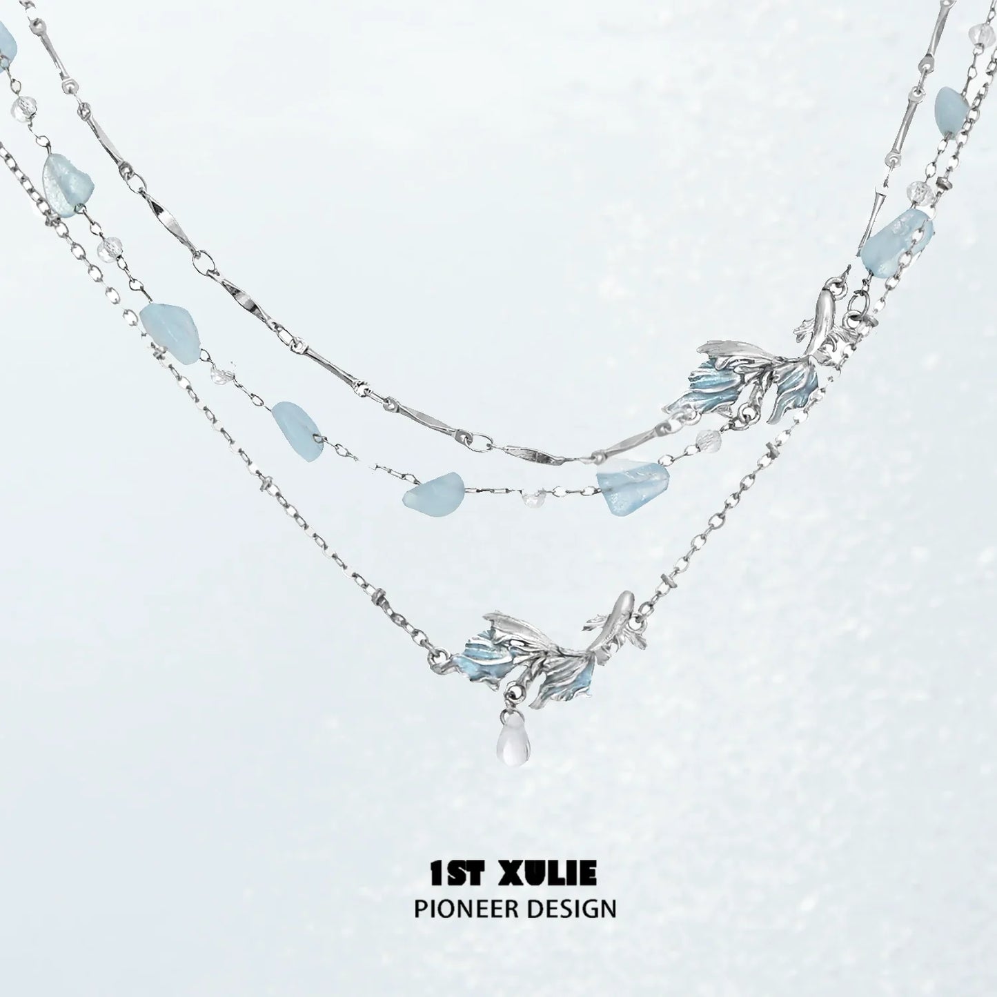 Playful fish necklace with silver chain and aqua-colored accents for a charming look
