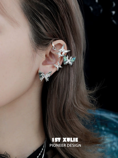 Punk butterfly ear clips showcasing a unique design with multiple butterfly accents for trendy ear jewelry