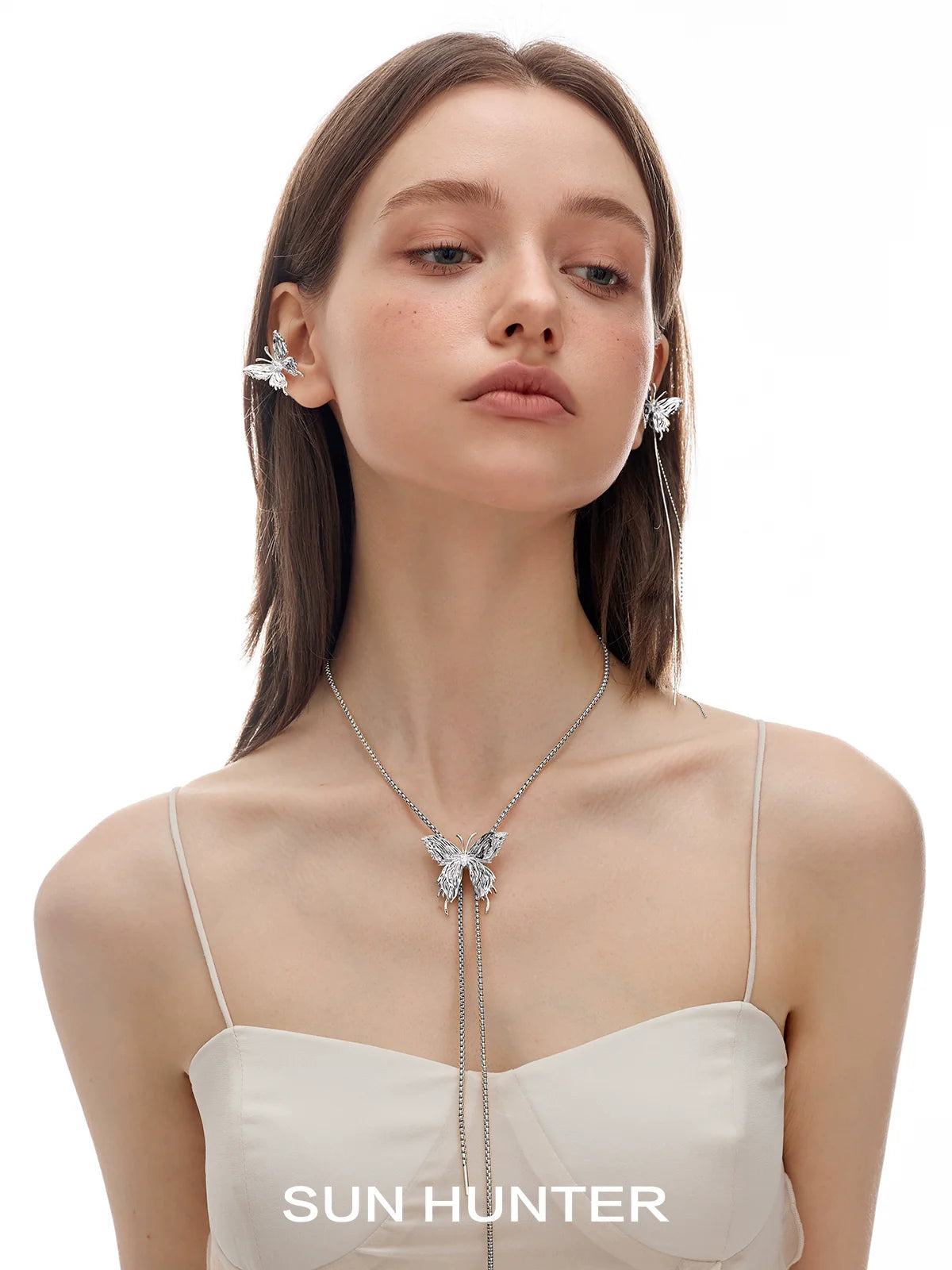 SUN HUNTER punk butterfly ear cuffs displayed on a model showcasing unique design and style