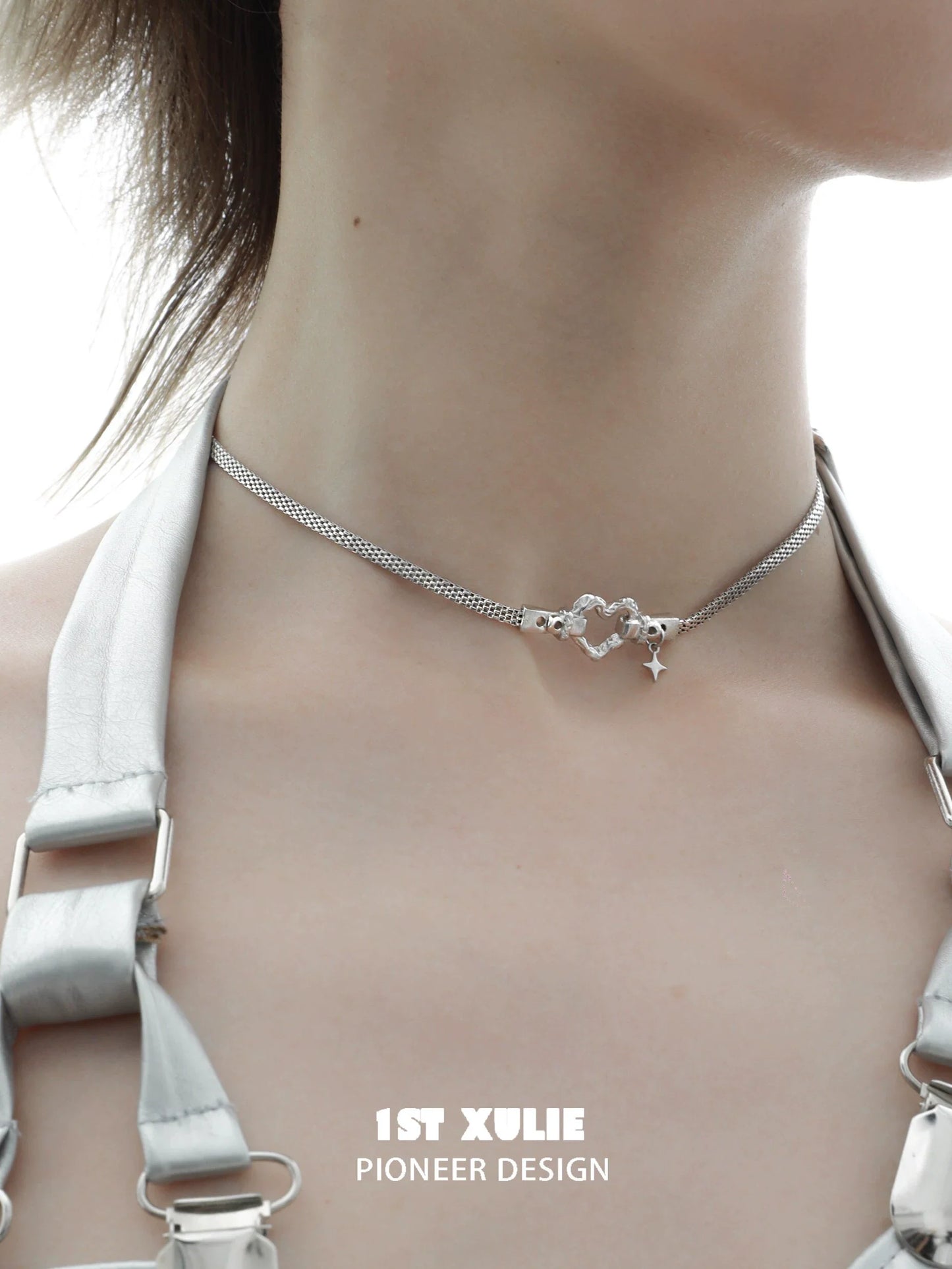Punk heart necklace in silver featuring a unique design with heart and star charms