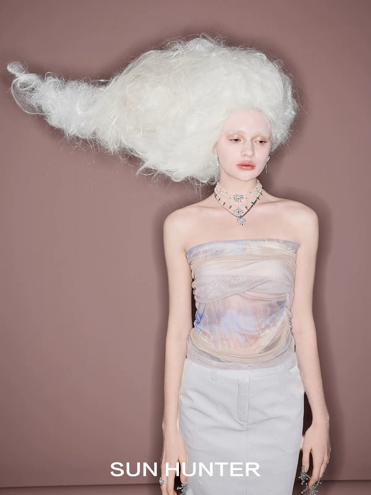 Model showcasing the SUN HUNTER punk heart rivet ring with a stylish outfit and unique hairstyle