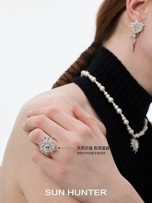 SUN HUNTER punk heart rivet ring featuring unique design and shimmering embellishments