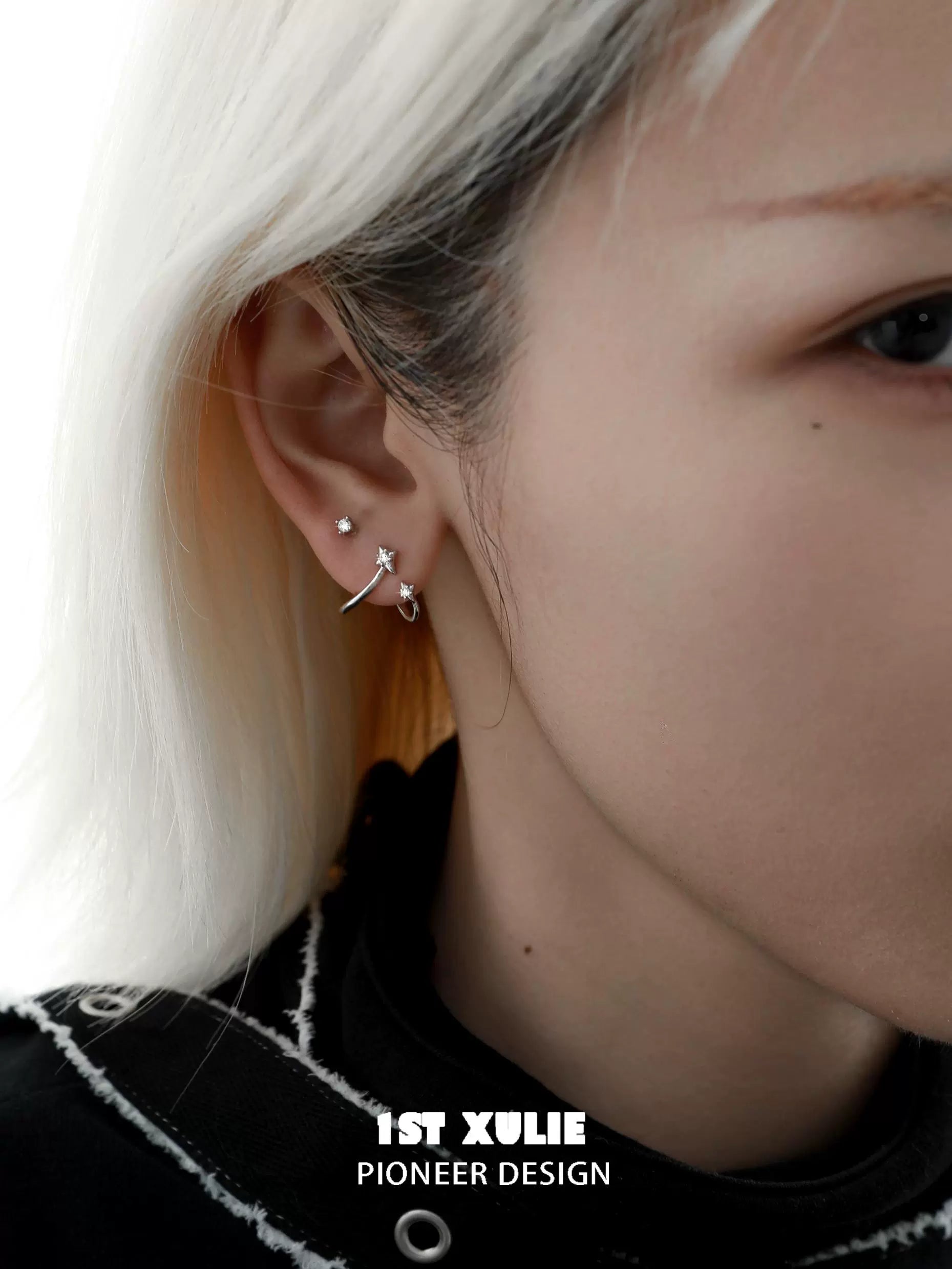 Stylish model wearing radiant zircon ear cuffs, showcasing modern earring design and elegance