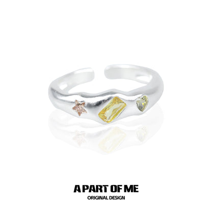 A PART OF ME rainbow star zircon ring with colorful gemstones in a unique design