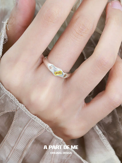 A PART OF ME rainbow star zircon ring featuring colorful gemstones and a unique design