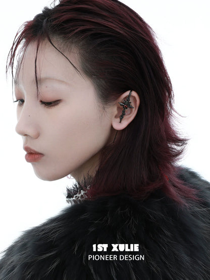 Rebel rose ear piercing needle showcased on a model with edgy hairstyle and striking accessories