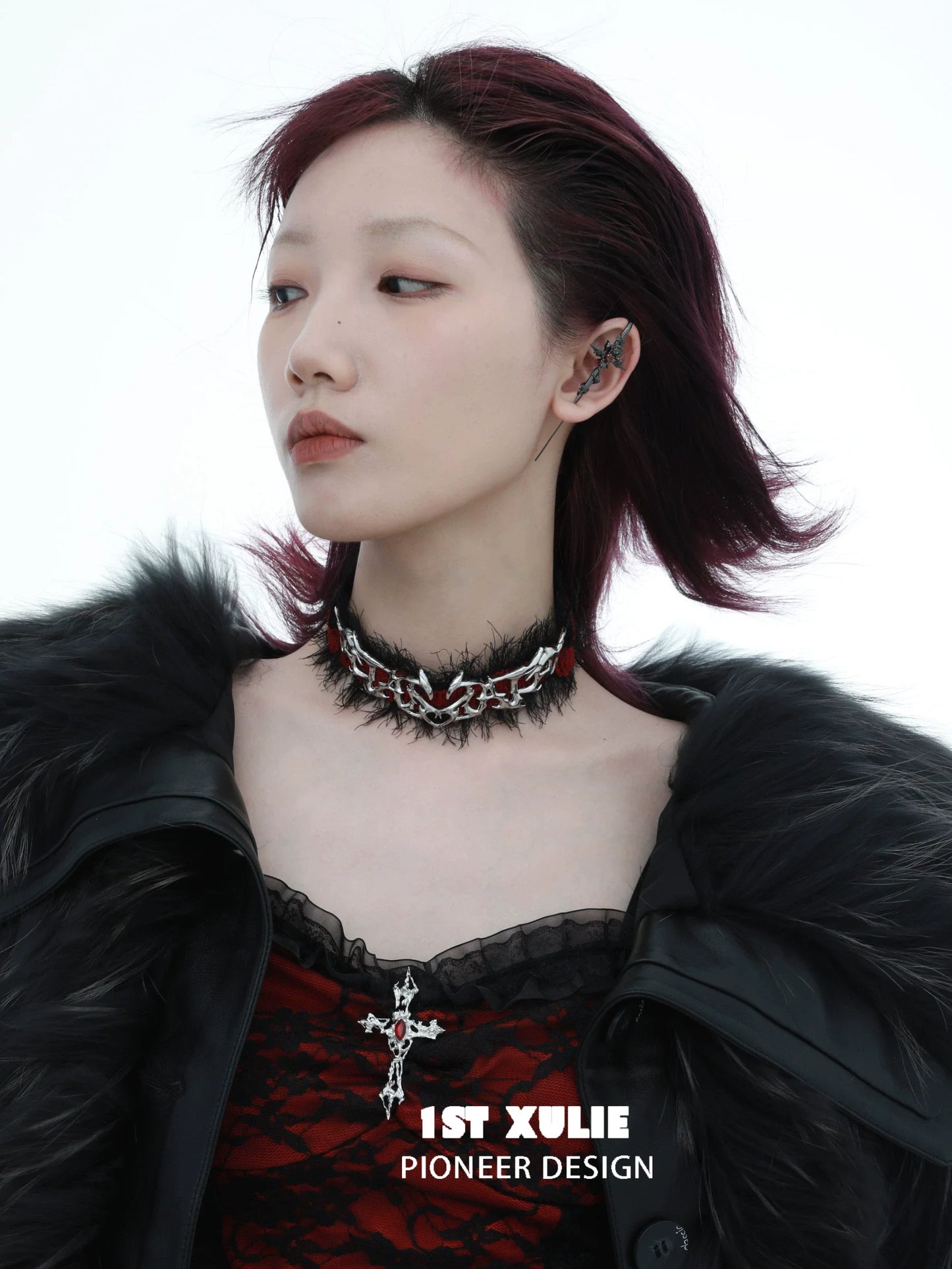 Model showcasing Rebel Rose Ear Piercing Needle in stylish black outfit with edgy accessories