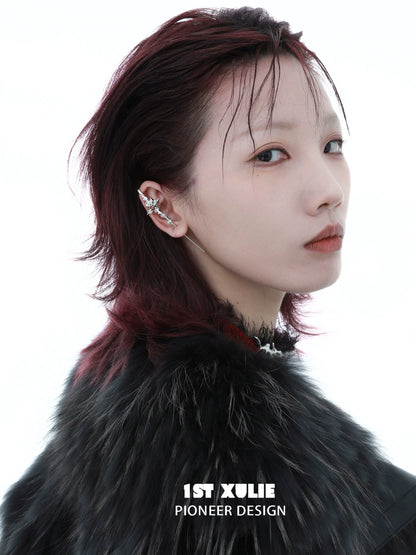 Model showcasing the Rebel Rose ear piercing needle with a stylish hairstyle and chic look