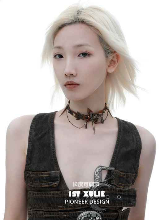 Model wearing a retro butterfly choker with intricate butterfly designs and an adjustable fitting