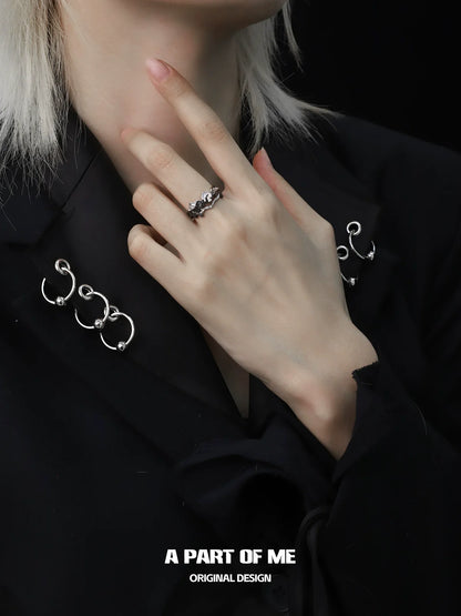 A PART OF ME sunrise moonset couple rings displayed on a hand with stylish black attire