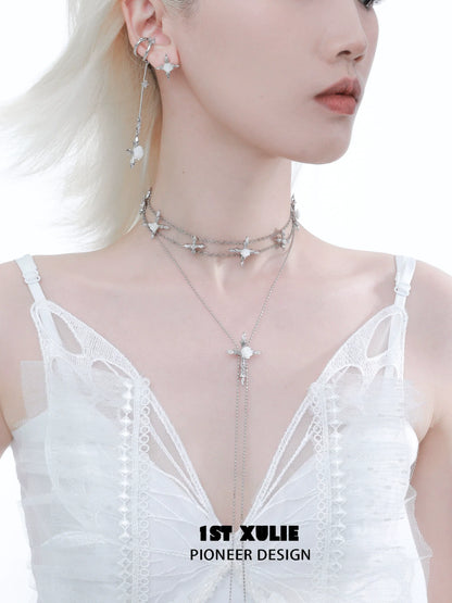 Elegant model wearing a rose cross necklace layered with silver chains and star charms