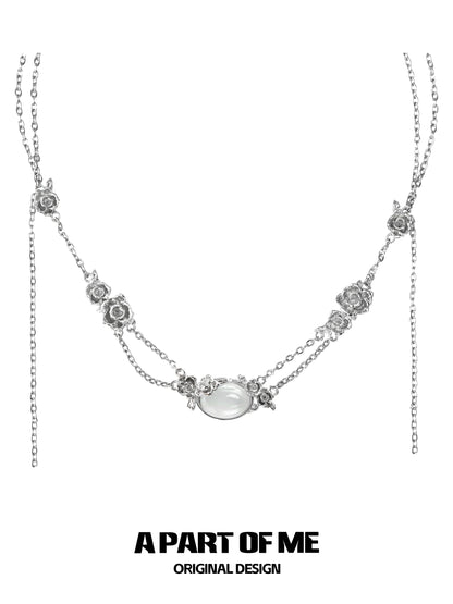 Elegant rose silver necklace from A PART OF ME featuring floral designs and a central stone