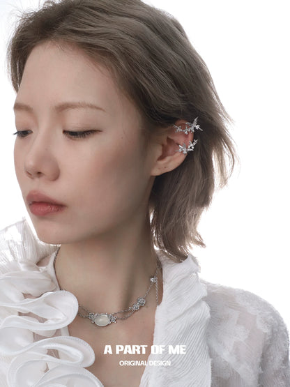 Elegant rose silver necklace with delicate floral designs worn by a model showcasing its beauty