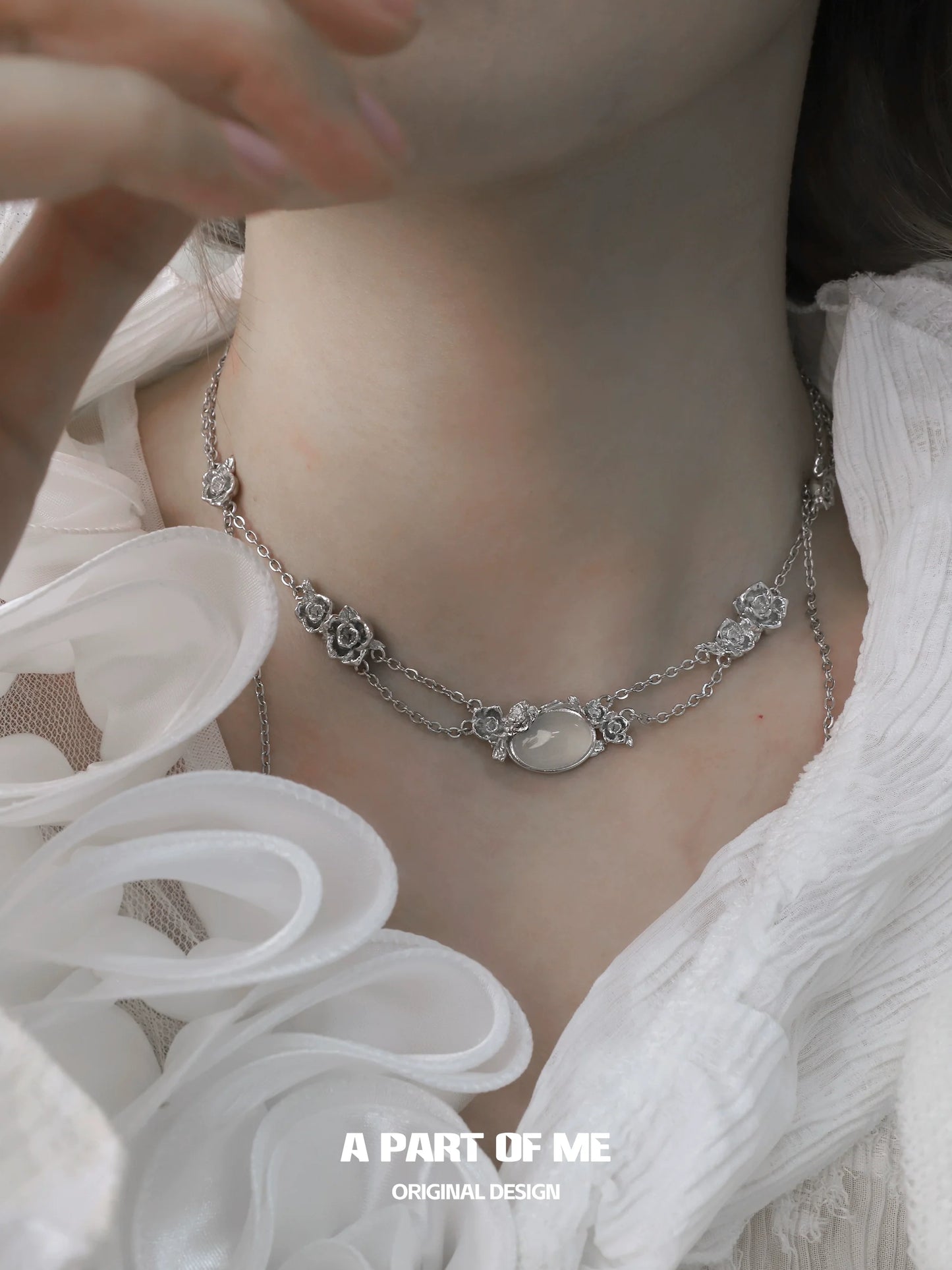 Rose silver necklace featuring elegant floral accents and a central pendant for a stunning look