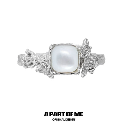 A Part of Me rose silver ring featuring a square pearl and detailed flower accents