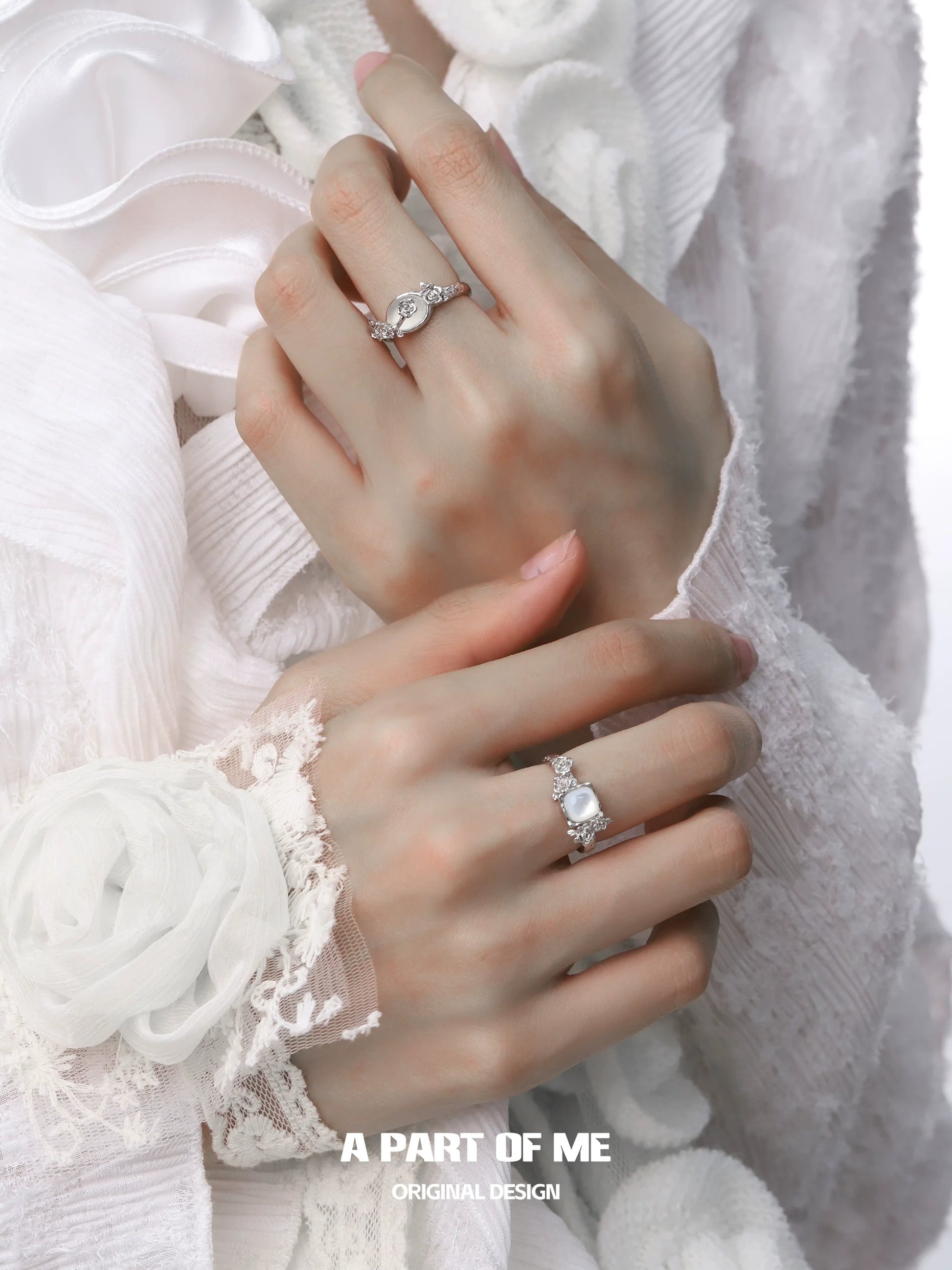 Elegant rose silver ring showcased on a model's hand with intricate designs and sparkling details