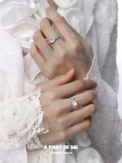 Elegant rose silver ring showcased on a model's hand with intricate designs and sparkling details