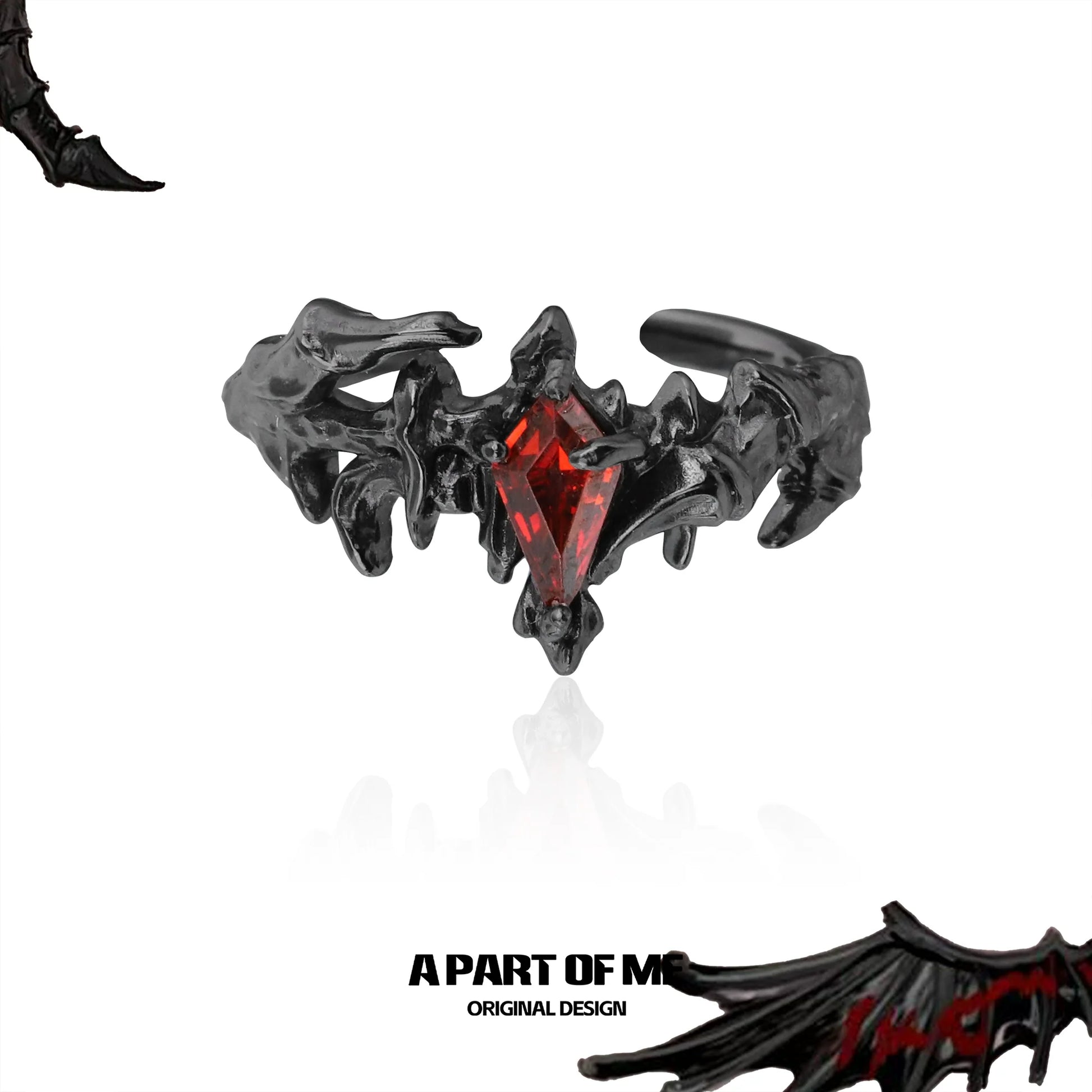 A PART OF ME ruby dragon wing ring in black with a striking red gemstone centerpiece