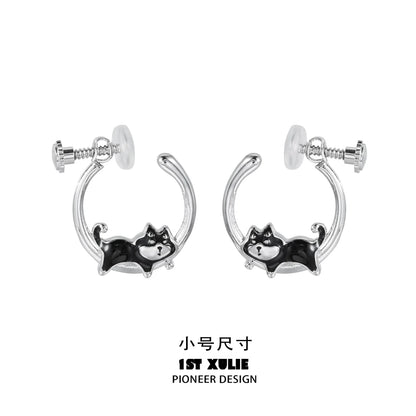 Sleek silver running puppy earrings featuring a playful design of a puppy in motion
