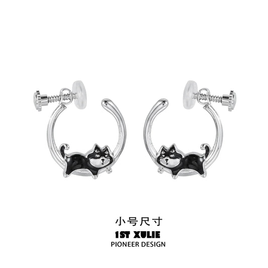 Sleek silver running puppy earrings featuring a playful design of a puppy in motion