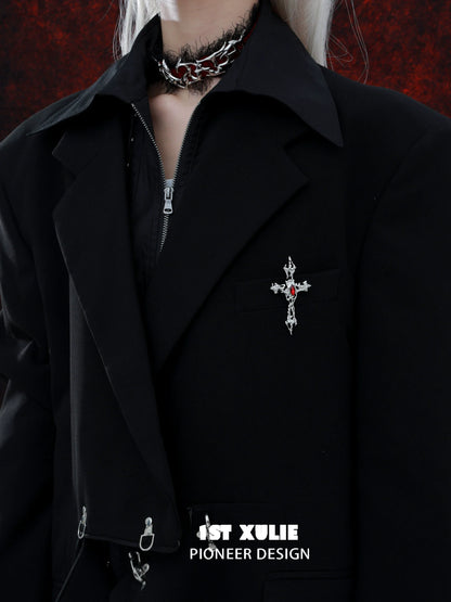 Sacred cross silver brooch on a black jacket for a bold, stylish accessory look