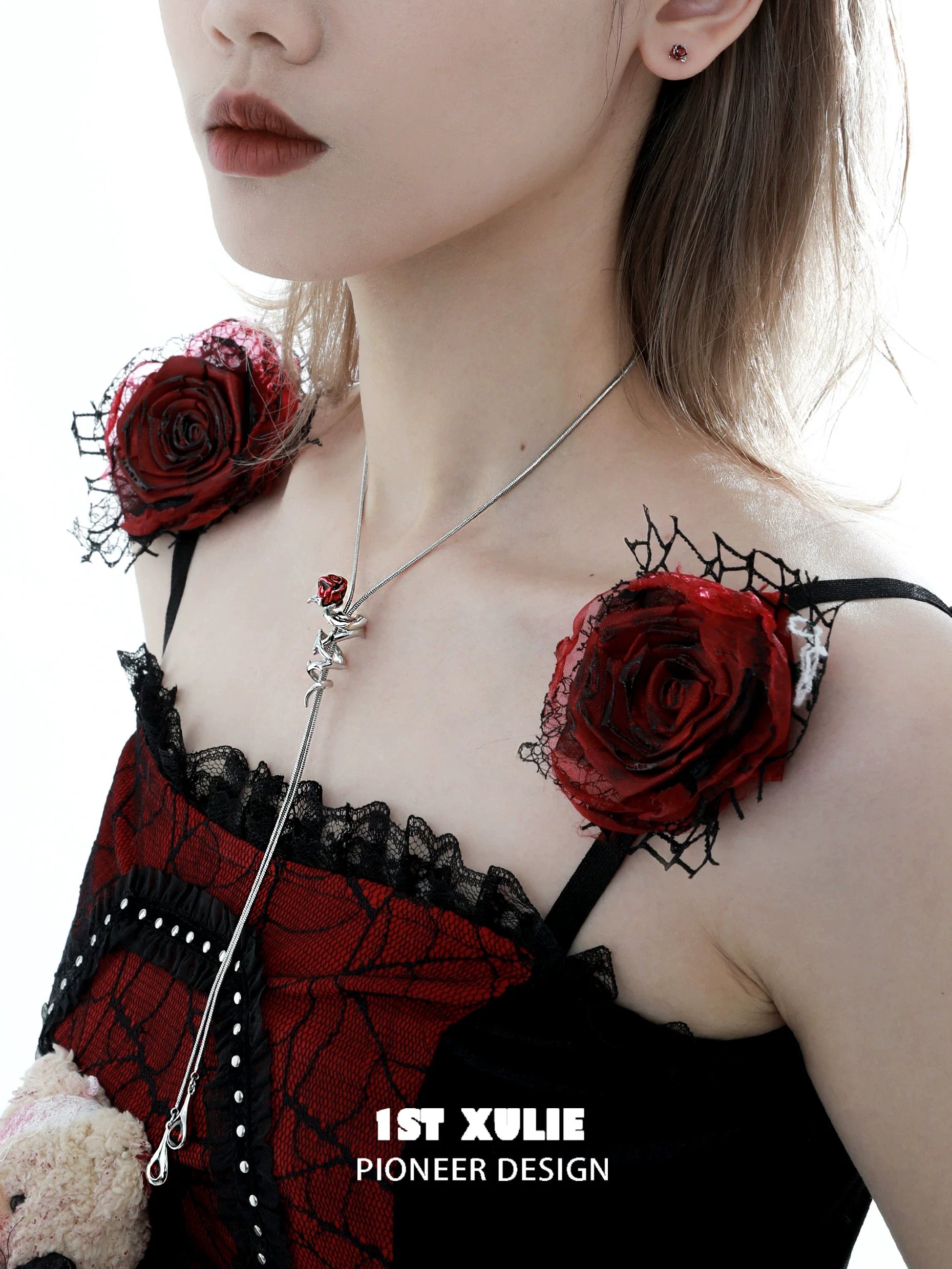 Scarlet rose clavicle chain necklace styled with a lace dress featuring red floral accents
