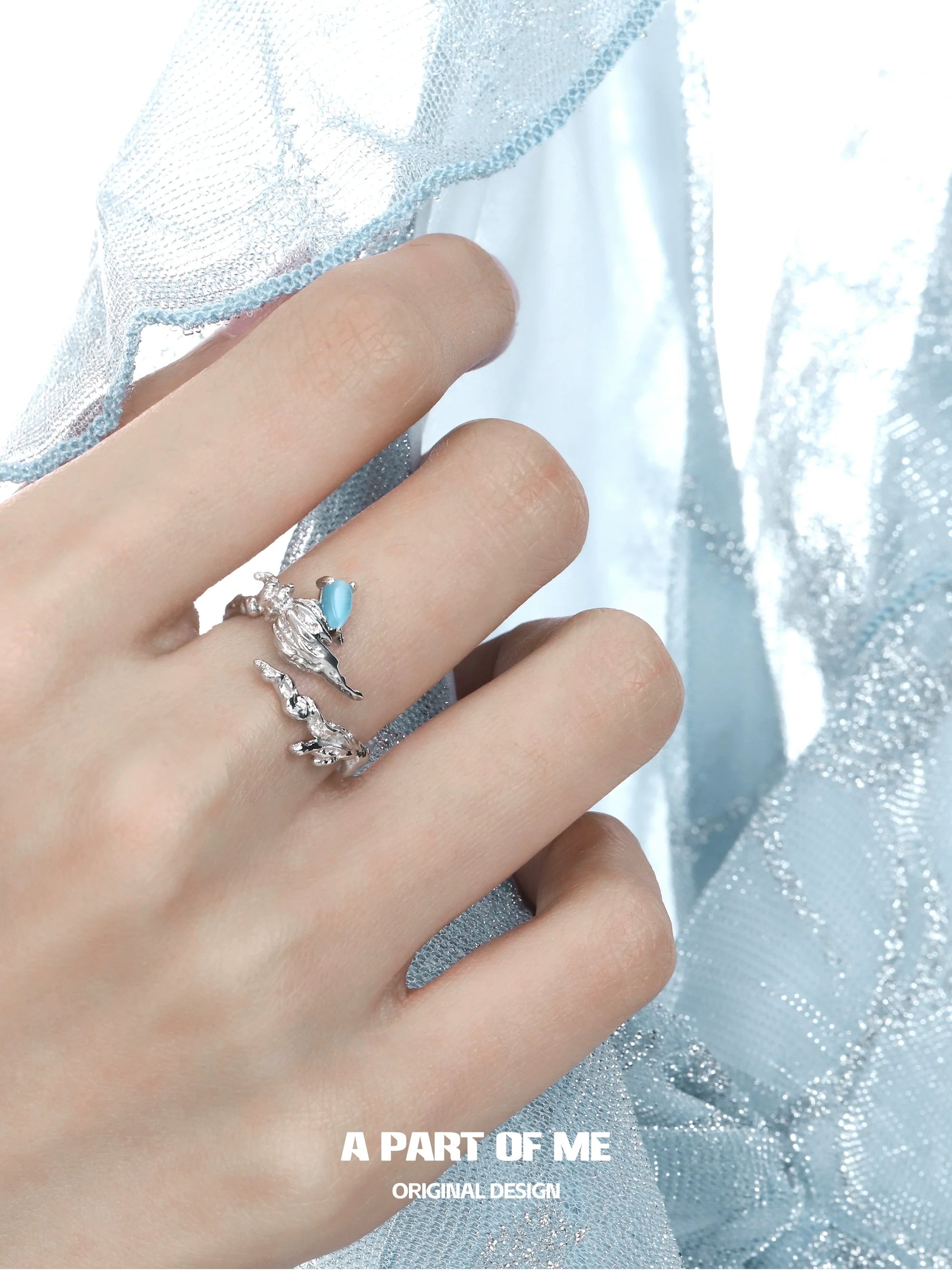 Elegant sea conch ring from A PART OF ME with a delicate design and light blue stone