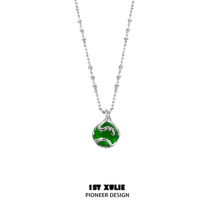 Serpent silver necklace featuring a unique design with a green accent for stylish elegance