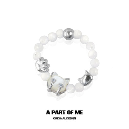 Shell cat beaded ring from A PART OF ME featuring intricate cat charm and white beads
